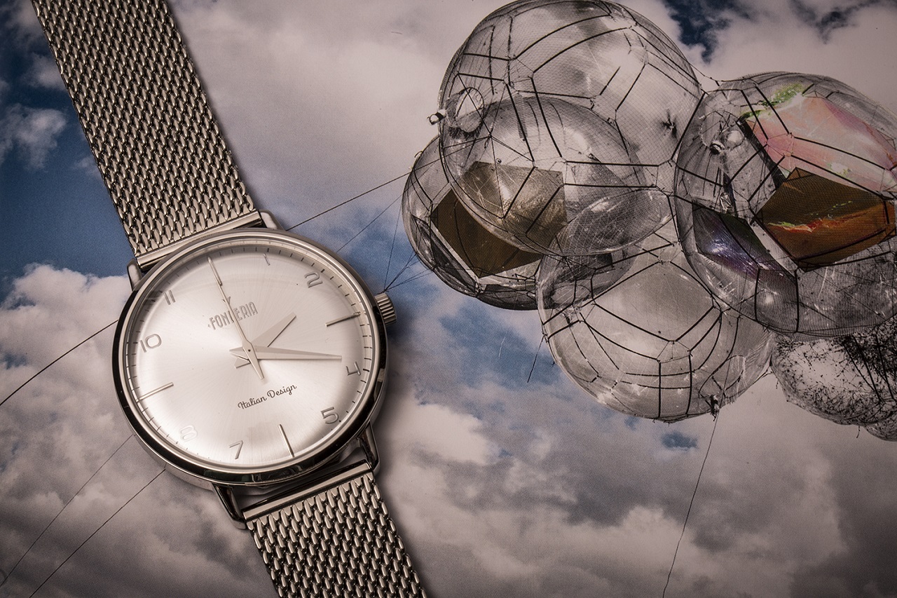 A quartz watch on a bed of clouds