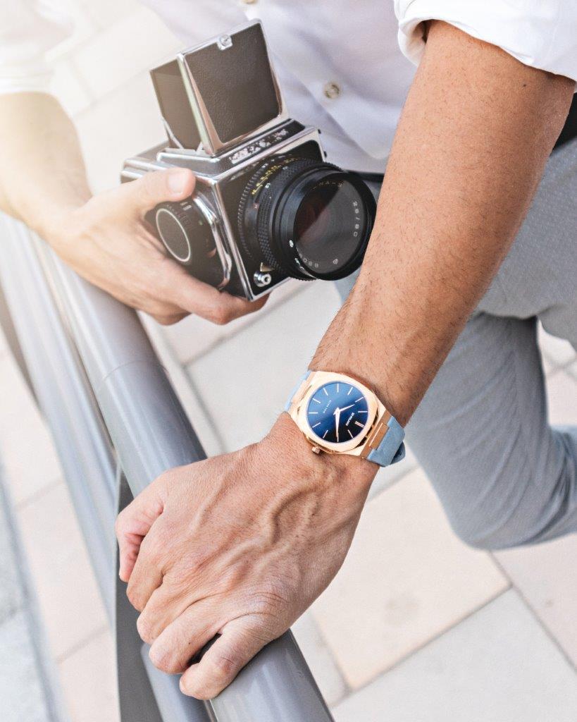 man with camera wearing D1 Milano Ultra Thin Classic