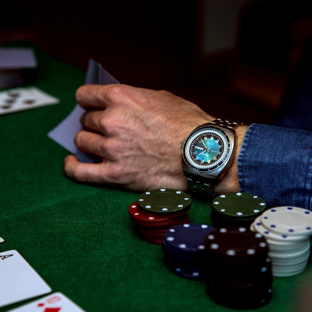 man on a poker table wearing Fonderia Lab Gambler Collection
